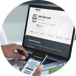 Client reviewing best law firms profile on laptop and firm website on phone